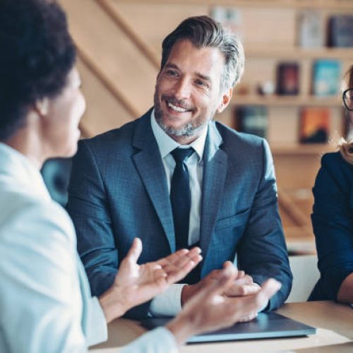 Business persons talking in the office